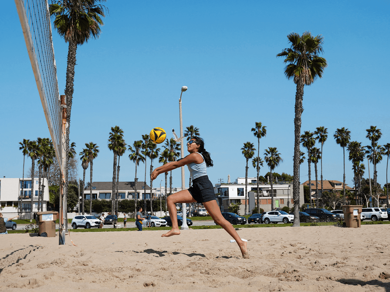 Player digging a ball at the net